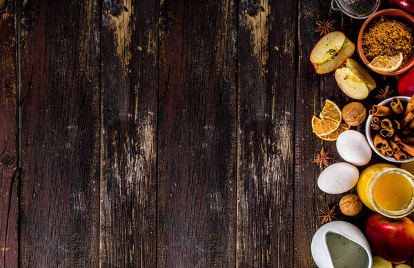 Autumn baking concept. Cooking baking background with ingredients, spices and utensils. All you need for baking traditional autumn apple pie, on rustic wooden background copy space