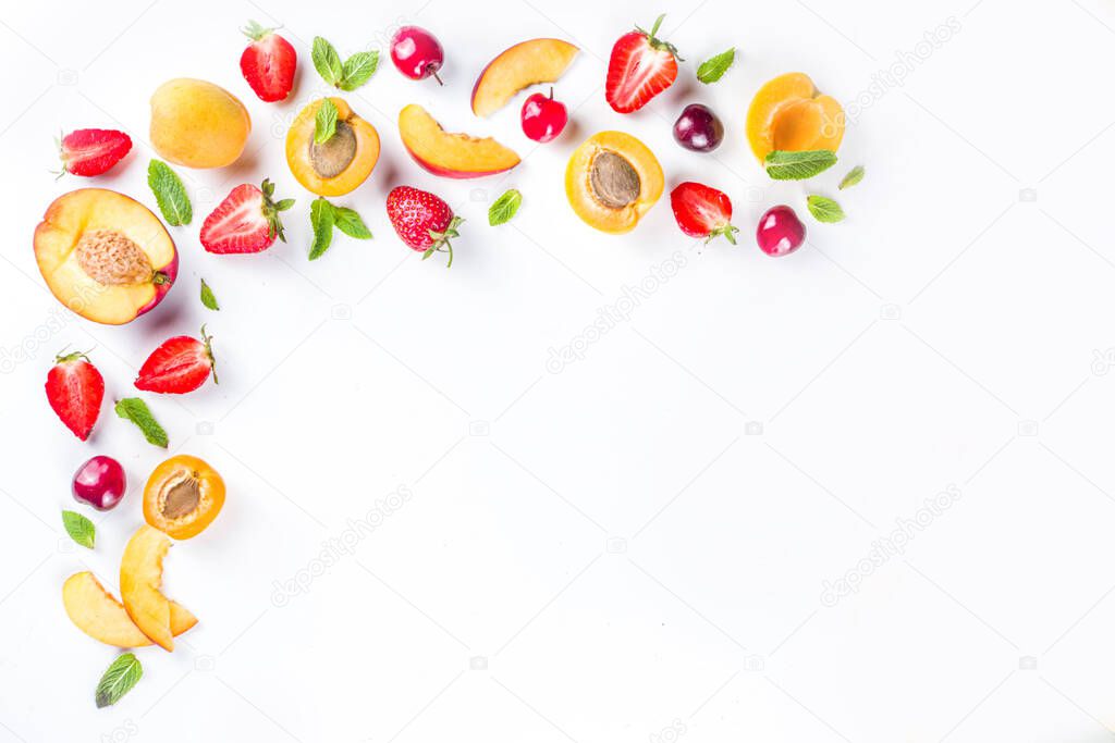 Summer background with fresh fruits and berries on white background. Set of various seasonal fruit and berry  - strawberry, apricots, peach slices, cherry, mint. Flat lay. Summer fruits concept. 