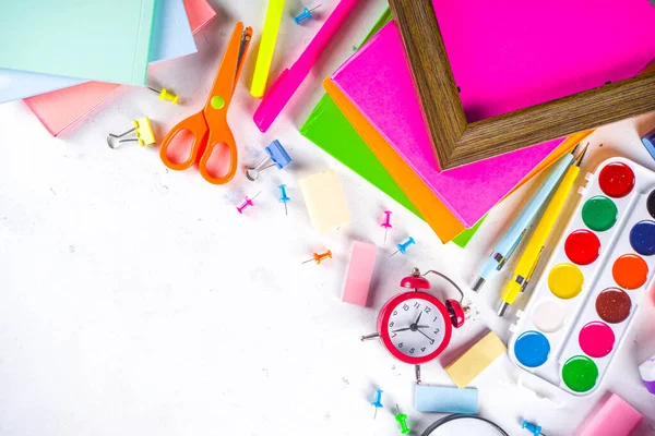 Back to school, education background. Back to School White Background with School Bag Backpack, Notebook, Pen, Pencil, Pencils, Magnifying Glass, Eraser, Paper Clip, Alarm Clock, School Supplies