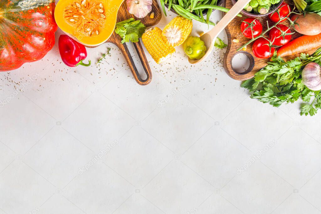 Autumn cooking background. Organic autumn harvest vegetables, raw vegan ingredients for cooking traditional thanksgiving and fall food on white background, top view