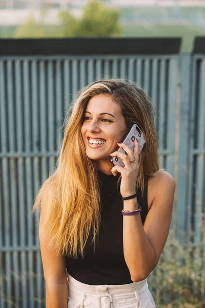 Beautiful woman using phone in outdoor