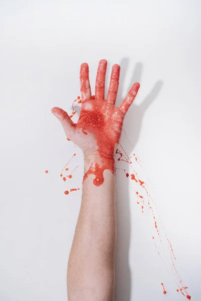 Arm Van Een Mens Rood Geschilderd Glitter Een Witte Achtergrond — Stockfoto