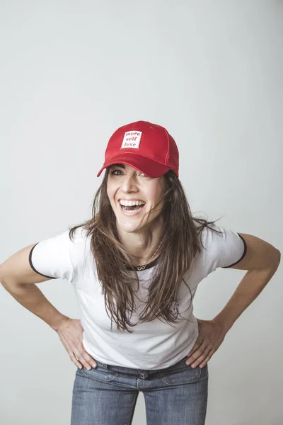 Happy beautiful woman with red hat in studio