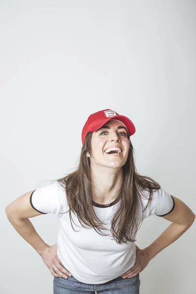 Happy beautiful woman with red hat in studio