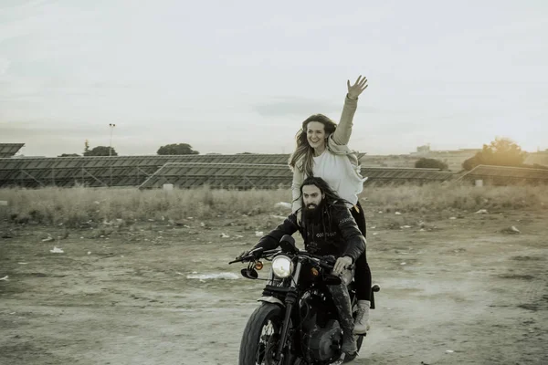 Woman and man happy in the motorcycle