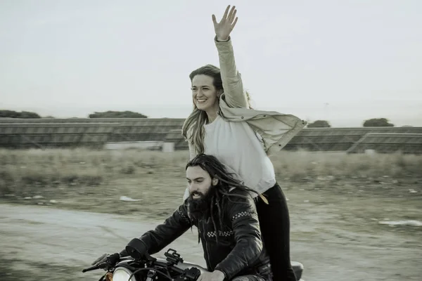 Woman and man happy in the motorcycle