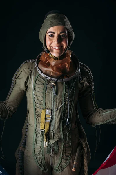 Young astronaut woman with helmet in studio