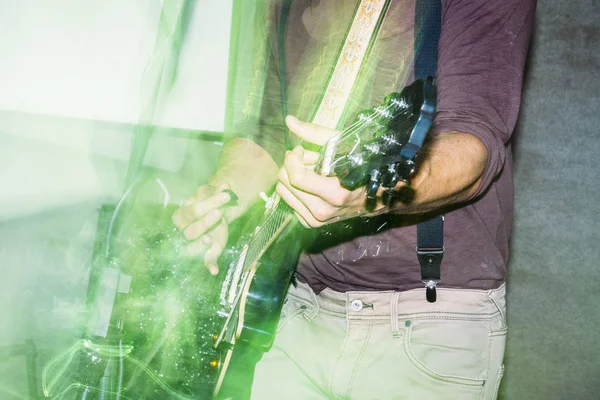 Playing guitar for a rock music concert. Abstract distortion pho — Stock Photo, Image
