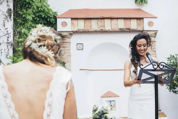 Master of ceremony: Bride speech on microphone in a wedding cele