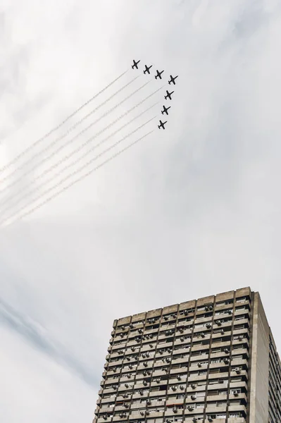 Aircrafts with white fume in sky — Stock Photo, Image