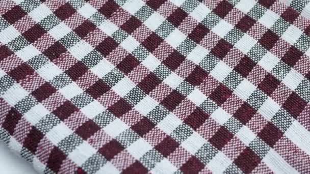 Fehér piros és fekete szövet mintát textil keresztül — Stock videók