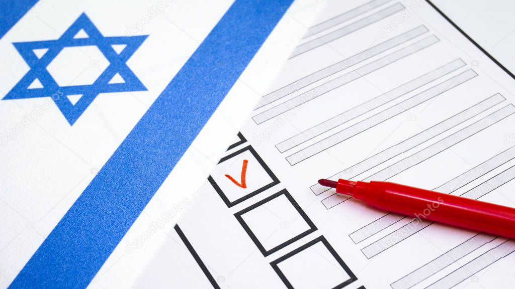 Voting in paper ballot by red pencil in Israel wirh Israeli flag