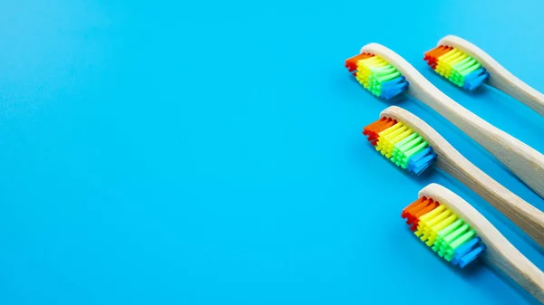 Rainbow Bamboo Wooden Toothbrushes Blue Background — Stock Photo, Image