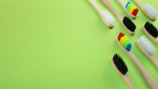 Black White Rainbow Bamboo Toothbrushes Green Background Concept Racism Social — Stock Photo, Image