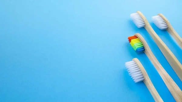 White Rainbow Wooden Toothbrushes Blue Background Concept Racism Social Exclusion — Stock Photo, Image