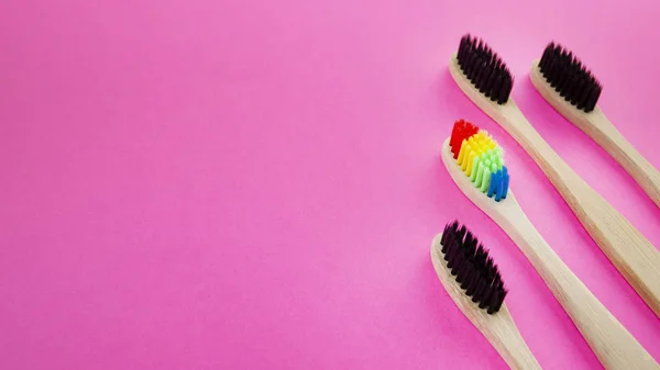Black Rainbow Wooden Toothbrushes Blue Background Concept Racism Social Exclusion — Stock Photo, Image