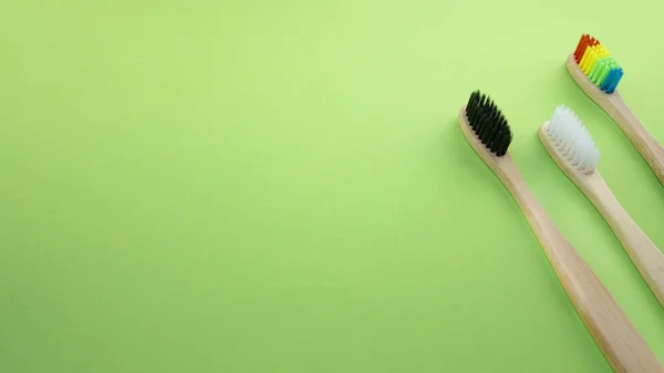 Black White Rainbow Bamboo Toothbrushes Green Background Concept Racism Social — Stock Photo, Image