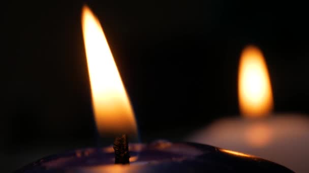 Two white and blue candles flame — Stock Video