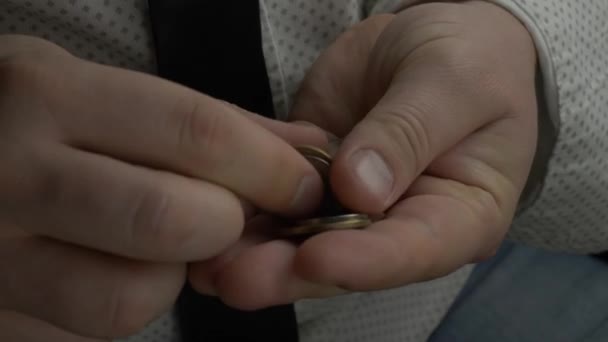 Businessman or manager counting coins in hands — Stock Video