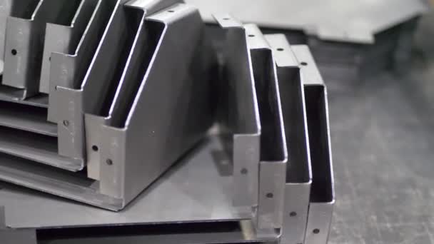 Metal parts after cutting and bending process — Stock Video