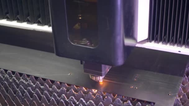 Laser cutting of flat sheet metal steel material with sparks — Stock Video