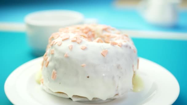 Condensed milk flows on delicious sweet donut — Stock Video