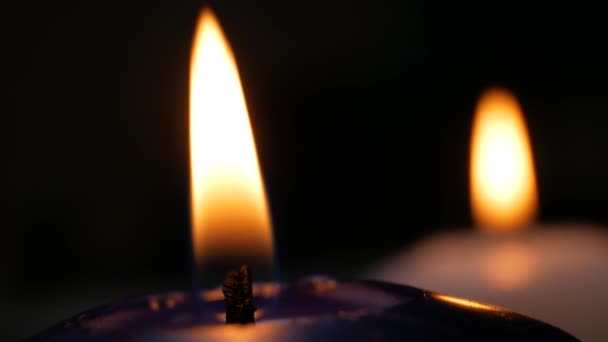 Two white and blue candles flame — Stock Video