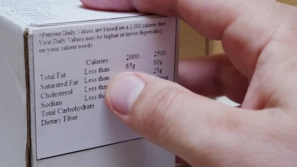 Reading Nutrition Label on Food Packaging — Stock Video