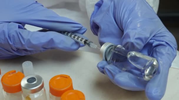 Nurse Draws Solution into Syringe from Vial in Clinic Office — Stock Video