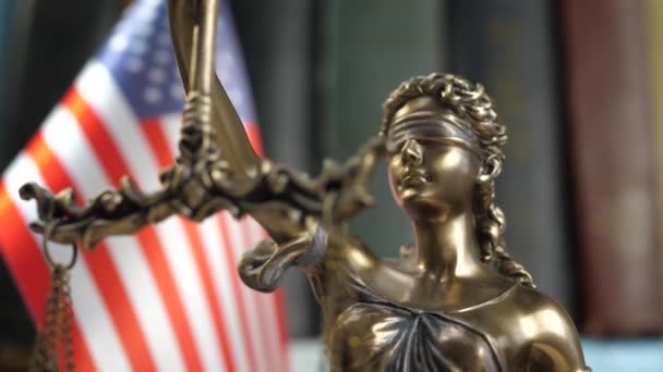 Statue of Lady Justice with Books and USA Flag — Stock Video