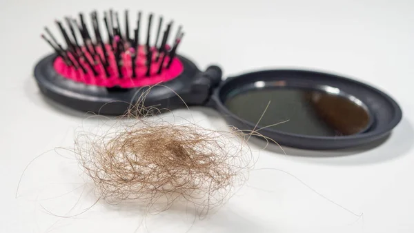 Long hair fall after combing in hairbrush