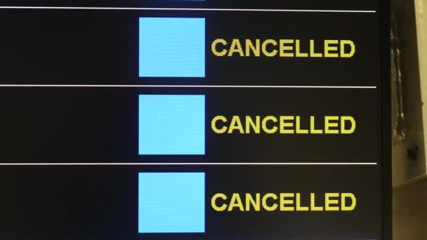 Cancelled flights on time schedule board — Stock Video