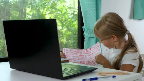 Pupil look on laptop camera and does lessons homework — Stock Video