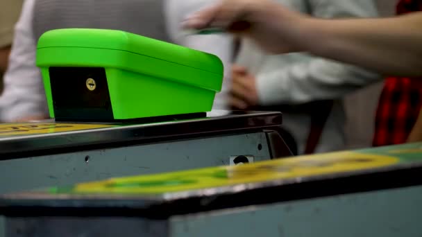 Male hand applies plastic card of bank to contactless reader — Stock Video