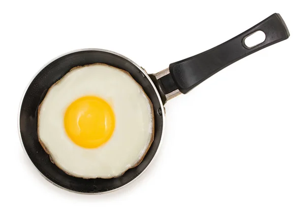 Одиночне смажене яйце на дуже маленькій сковороді з ізоляцією поверхні, що не торкається палички Ліцензійні Стокові Фото