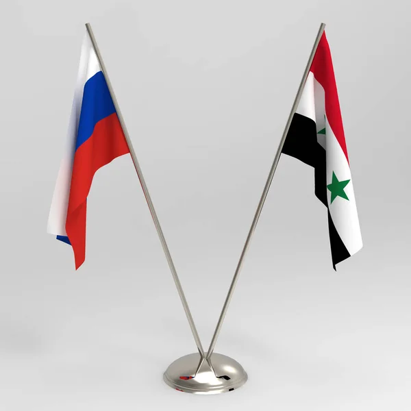 RU flag and Syria flag on a grey background, table flags 3d render. Relations between the Russia and Syria