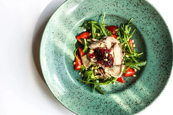 Top view of warm salad with meat