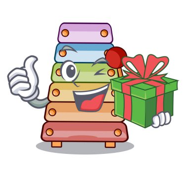 Tokmaklar maskot vektör çizim üzerinde ile hediye renkli oyuncak ksilofon