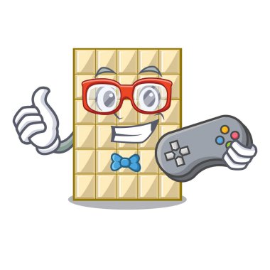 Oyun beyaz maskot ahşap masa üzerinde çikolata