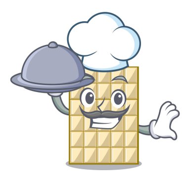 Şef yemek beyaz maskot ahşap masa üzerinde çikolata ile