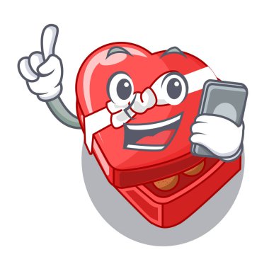 Çizgi film tablosunun üst kısmındaki telefon çikolata kutusu kalp ile