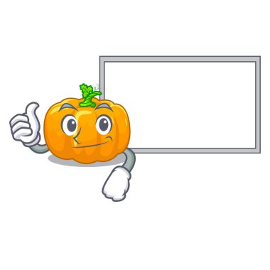 Başparmak yukarıya ahşap maskot tablonun üst kurulu sarı kabak ile