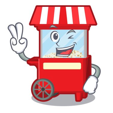 Karikatür masanın yanında iki parmak patlamış mısır makinesi