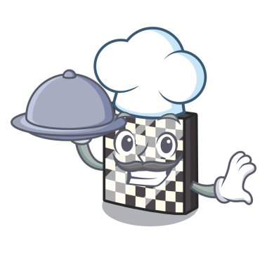 Karakter ahşap masa üzerinde gıda satranç tahtası ile Şef