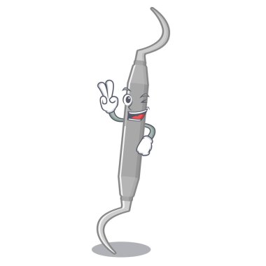 Maskot ahşap masa üzerinde iki parmak diş almak