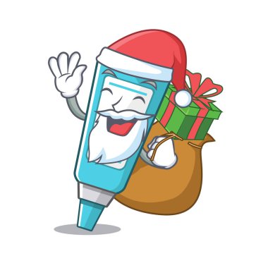 Maskot ahşap masa üzerinde hediye merhem ile Santa