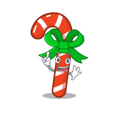 Maskot masanın üzerinde parmak şeker baston