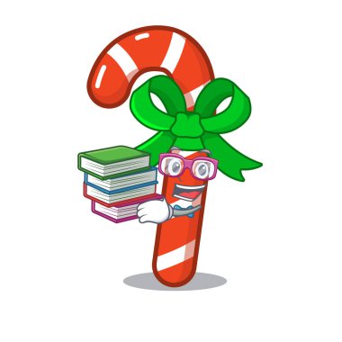 Maskot masanın üzerinde kitap şeker baston ile Öğrenci