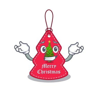 Sırıtan Noel etiketi maskot şeklinde asılı.