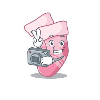 Profesyonel bir fotoğrafçı bebek çorapları karikatürü. Kamerayla çalışıyor.